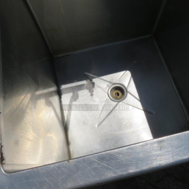 Stainless steel L-shaped work space with integrated handsink and deep sink, dimensions 81x105x41 inches.