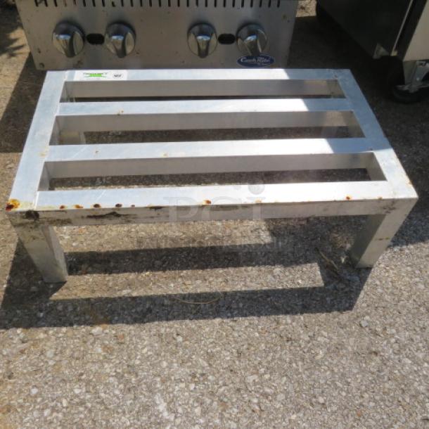 Regency Aluminum Dunnage Rack, model 600DUN1424, 24x14x8 inches. Visible wear and rust spots on edges.