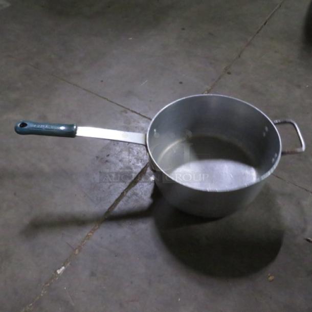 12-inch aluminum sauce pot with long handle, secondary side handle, and minor wear. Ideal for cooking, no visible markings.