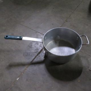 12-inch aluminum sauce pot with long handle and pour spout; metallic finish; good condition; suitable for cooking.