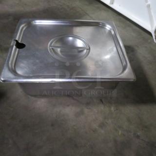 Half-size 4-inch deep stainless steel hotel pan with lid, used, suitable for food service storage.