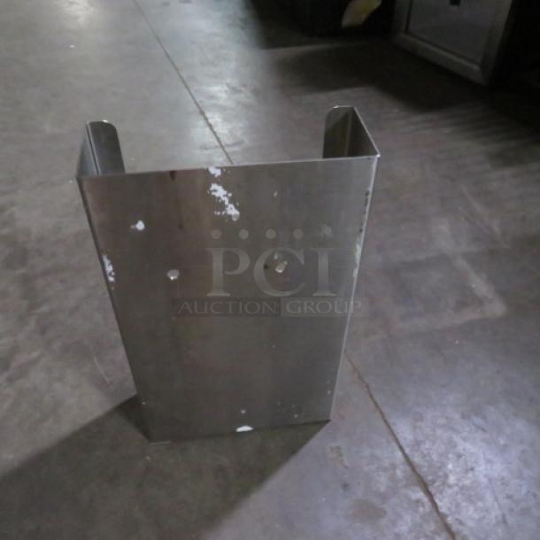 Stainless steel glove box holder with surface wear, showing scratches and two mounting holes. Suitable for wall attachment.