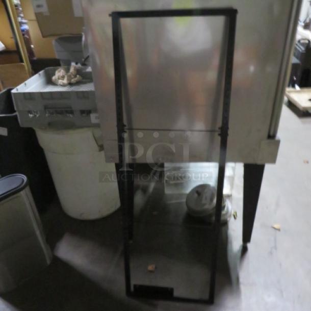 Black metal sign frame, 17x50 inches, in used condition. No visible markings. Sturdy construction for signage display.
