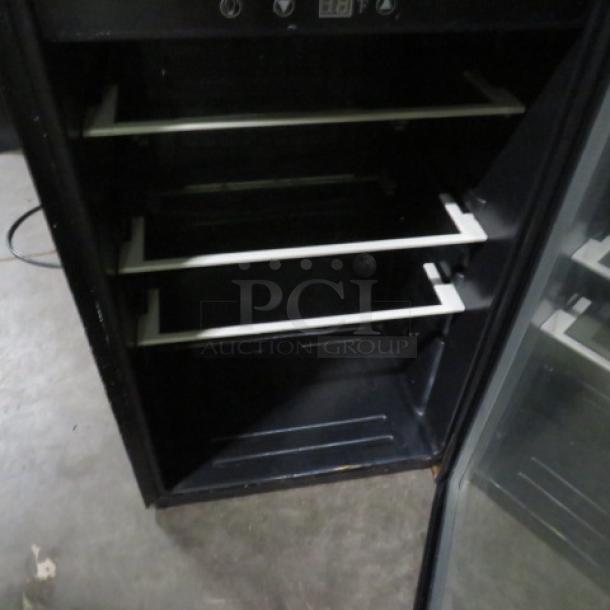 Tramontina glass door wine bar display cooler, model 80901/102, with adjustable shelves, 115V, 20x22x31 inches.