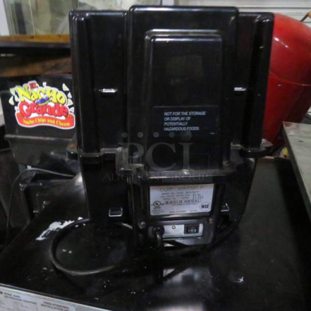 Gold Medal Nacho Chips and Cheese Warmer, Model 5330, 120 Volt. Black unit with visible branding and operational labels.