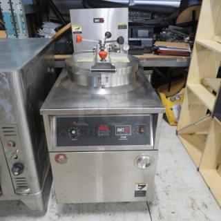 BKI FKM-F 75lb electric pressure fryer on casters, 208V, stainless steel, 24x39x50 inches, working condition.
