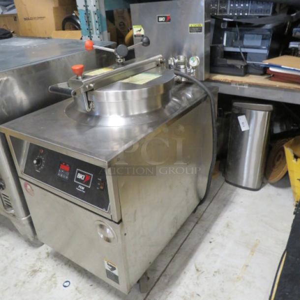 BKI FKM-F 75lb electric pressure fryer on casters, stainless steel, 208 Volt, 24x39x50 inches, working condition when removed.