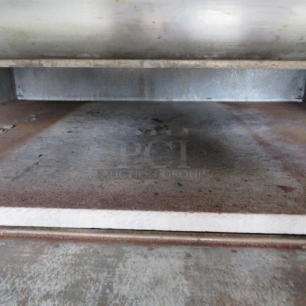 Blodgett Model 981 double deck oven, natural gas, intact stones, rear draft diverter, condition as removed, 60x38x38 inches.