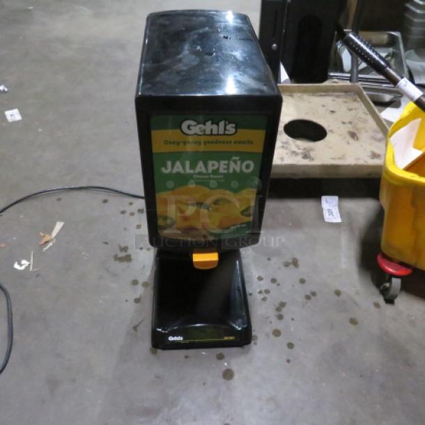 Gehls Nacho Cheese Dispenser, Model HT2-01, 120V, 8x14x23 inches, jalapeño cheese label, used condition.