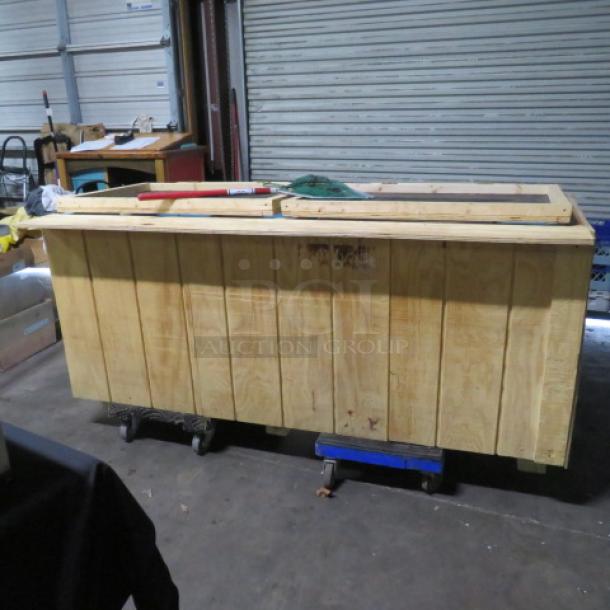 Wooden live bait box, dimensions 77x36x34 inches, sturdy construction, visible signs of use, suitable for bait storage.