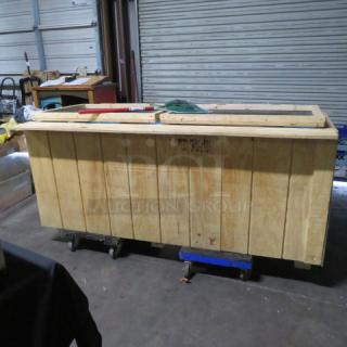 Wooden live bait box, dimensions 77x36x34 inches, sturdy construction, visible signs of use, suitable for bait storage.