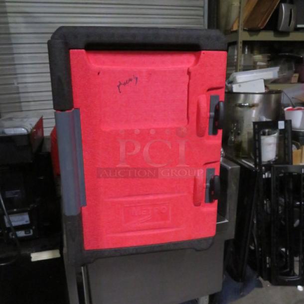 Metro MC400 portable food transport, red, used, visible locking handles, Metro logo embossed on front, minor scuffs.