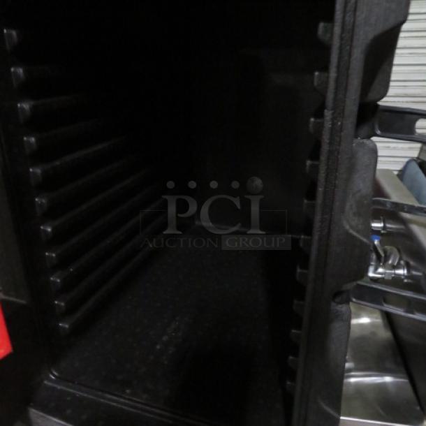 Metro MC400 Portable Food Transport, open interior view with ridged shelves. Used condition, ideal for catering logistics.