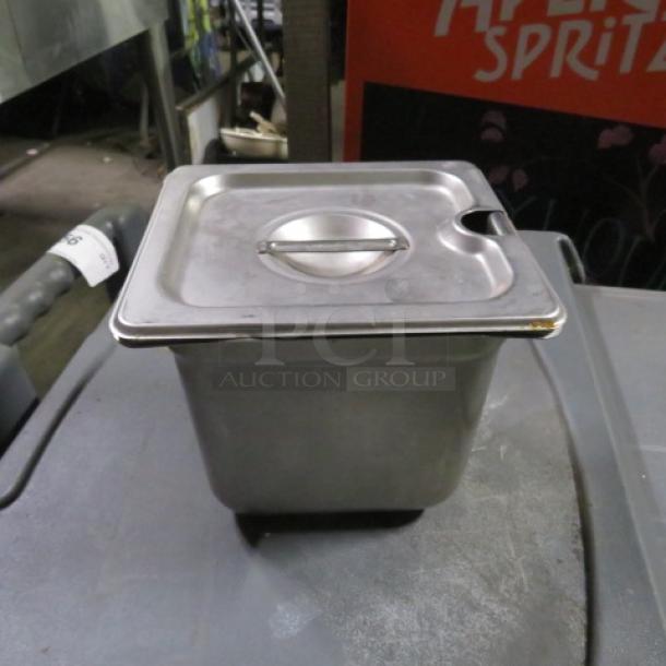 1/6 size 6-inch deep hotel pan with lid, stainless steel, light wear, ideal for commercial kitchen use.