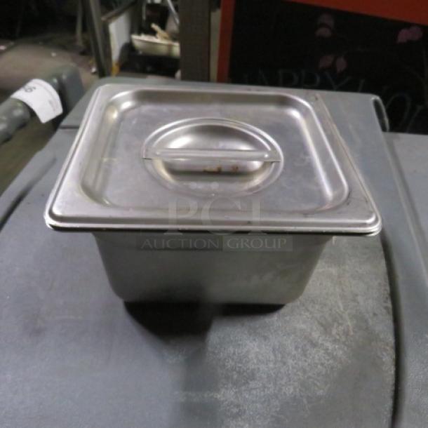 1/6 Size 4 Inch Deep Hotel Pan with Lid, stainless steel, used condition, model 3XBID, durable and versatile.