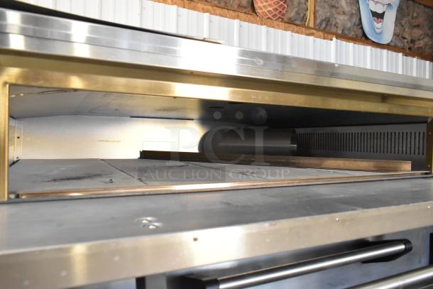 Marsal SD448 stainless steel single deck pizza oven with cooking stones, natural gas powered, 95,000 BTU capacity.