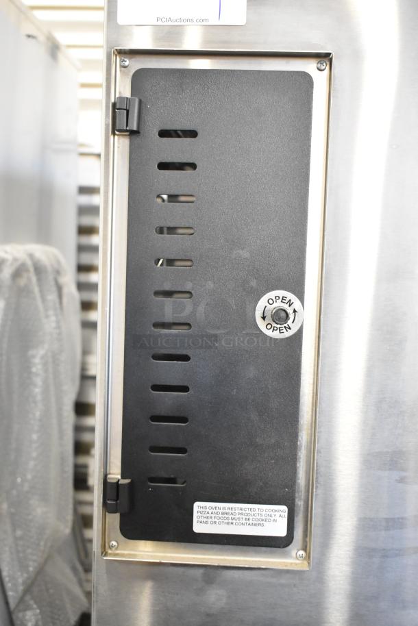 Marsal SD448 stainless steel single deck pizza oven, natural gas, with cooking stones, vent door labeled "Open."