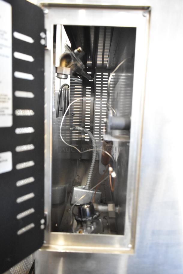 Interior view of Marsal SD448 pizza oven with visible gas connections and wiring. Stainless steel construction. Model labels on door.