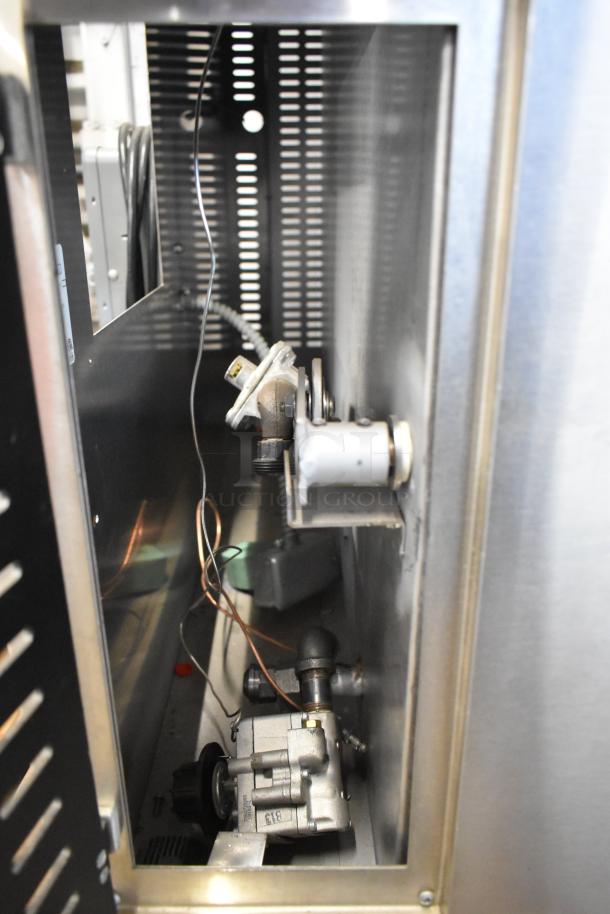 Interior view of Marsal SD448 natural gas pizza oven, showing components and stainless steel construction.