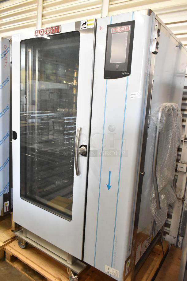 Brand new Blodgett BCT-202 stainless steel commercial combi oven, view-through door, metal pan rack, minor scratches.