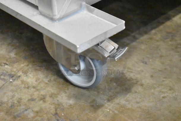 Blodgett metal portable rack with caster wheel for combi convection ovens. Brand new, minor scratches visible.