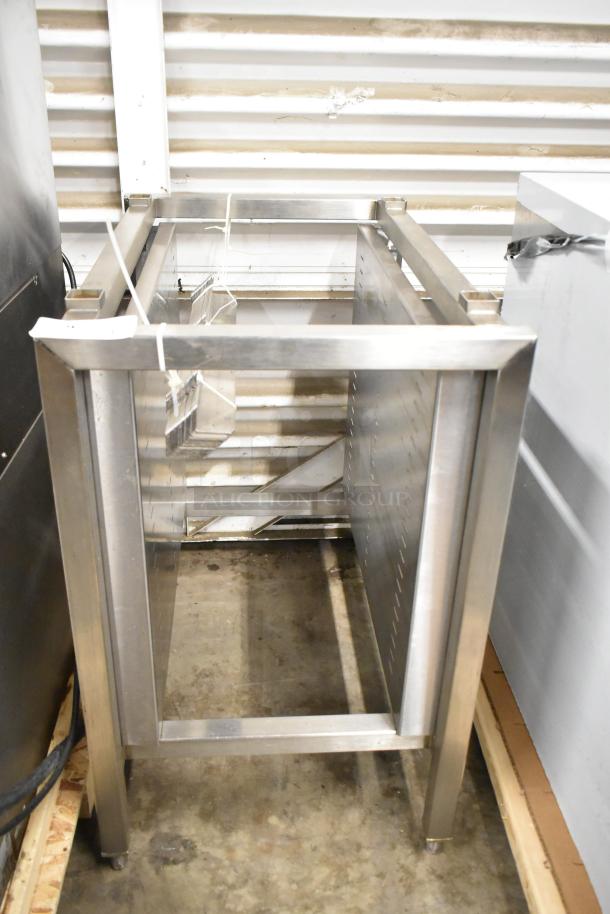 Brand new metal commercial pan rack with scratches and dents. Sturdy construction, ideal for kitchen use, visible structural integrity.