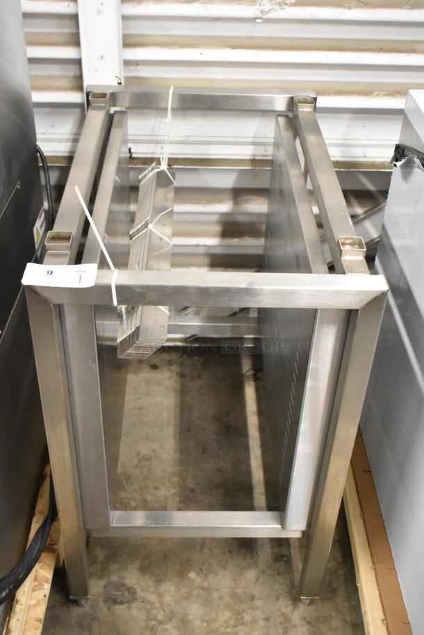 Brand new metal commercial pan rack with minor scratches and dents. Visible tag indicating auction listing.