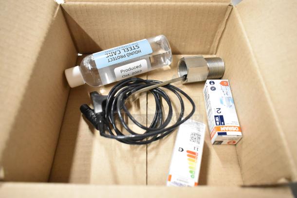 Box contents include a bottle labeled "Hound Protect Steel Care," a black cable, a metal fitting, and Osram light bulb packaging.