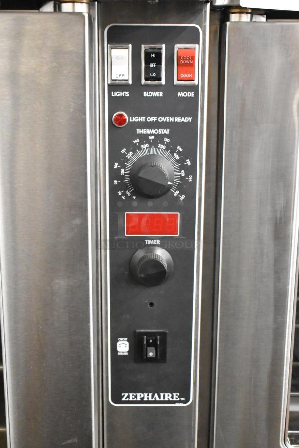 Alt text: "Blodgett Zephaire-200-E electric convection oven controls showing thermostat, timer, and mode switches."