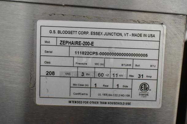 Label on Blodgett Zephaire-200-E convection oven, details power specs: 208 VAC, 3 PH, 60 Hz, 11 kW, 31 Amp. Made in USA.