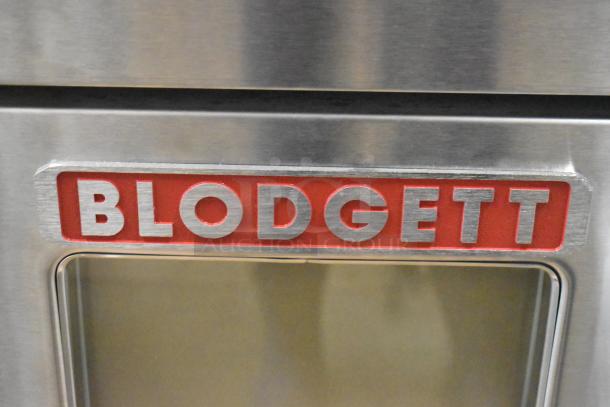 "Blodgett logo on the 2016 DFG100 stainless steel convection oven, view-through doors, brand new scratch and dent condition."