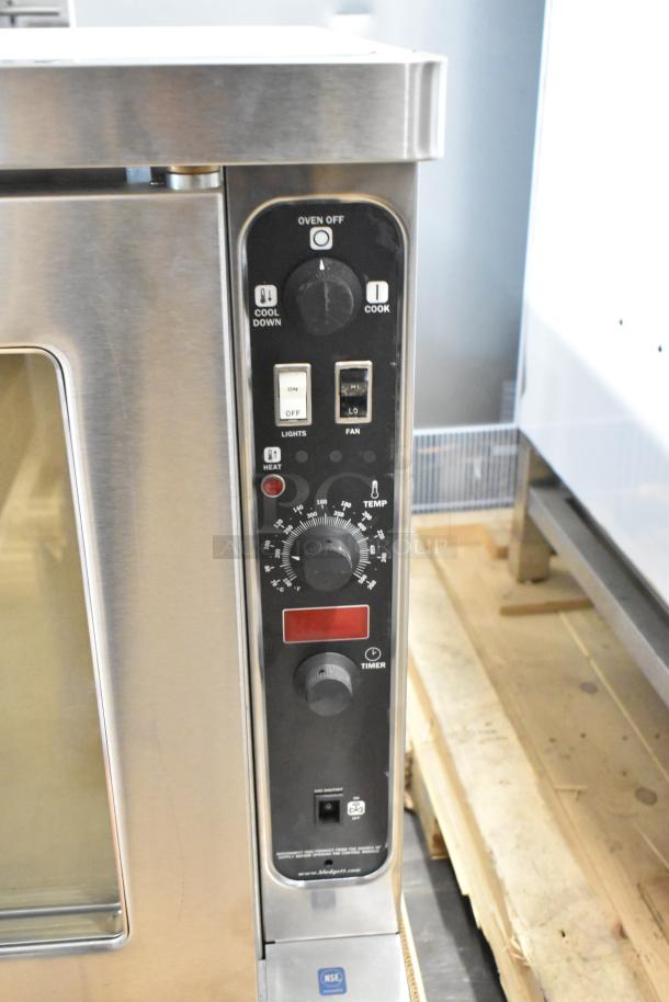 Stainless steel Blodgett DFG100 commercial convection oven, new with minor dents, view-through doors, thermostatic controls.