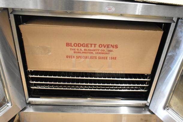 Brand new 2016 Blodgett DFG100 stainless steel convection oven with view-through doors and metal racks.