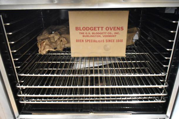 Brand new Blodgett DFG100 convection oven, stainless steel, view-through doors, metal racks, thermostatic controls.