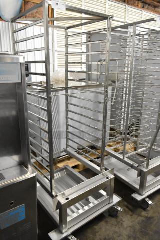 Brand new Blodgett metal portable rack for combi convection ovens, minor scratches and dents visible, on casters for mobility.