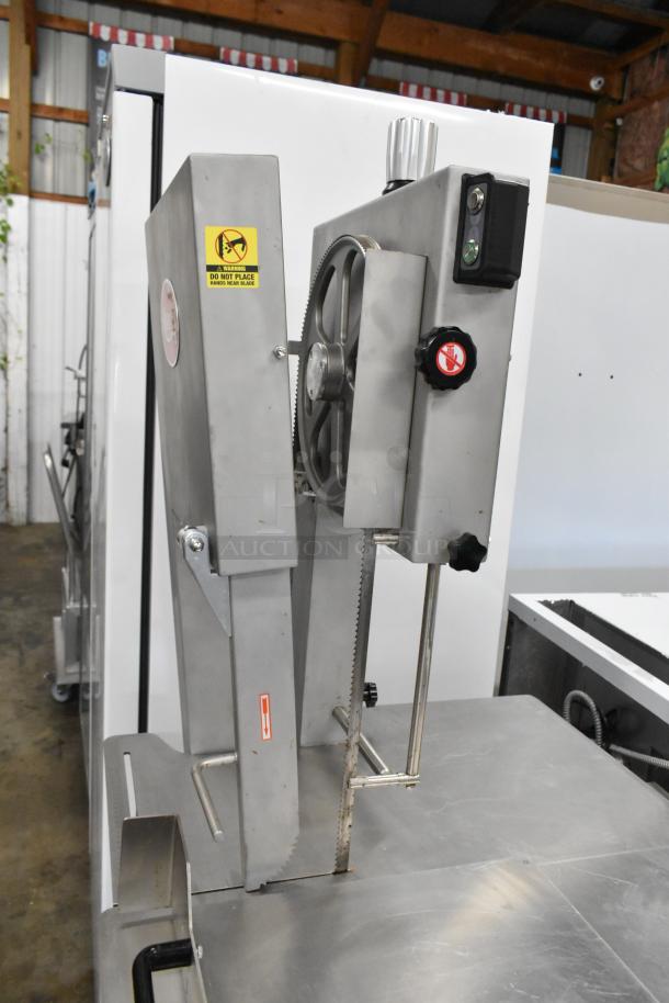 Brand new Avantco EMBS94SS vertical band meat saw, stainless steel, 94" blade, 220V, 3 phase, scratch and dent condition.