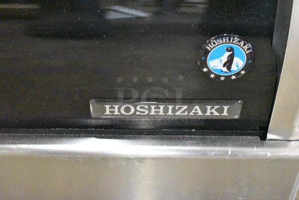 Brand new Hoshizaki HNC-180BA-R-SLH countertop sushi display case with curved glass, 115V, 1 phase. Features Hoshizaki logo.