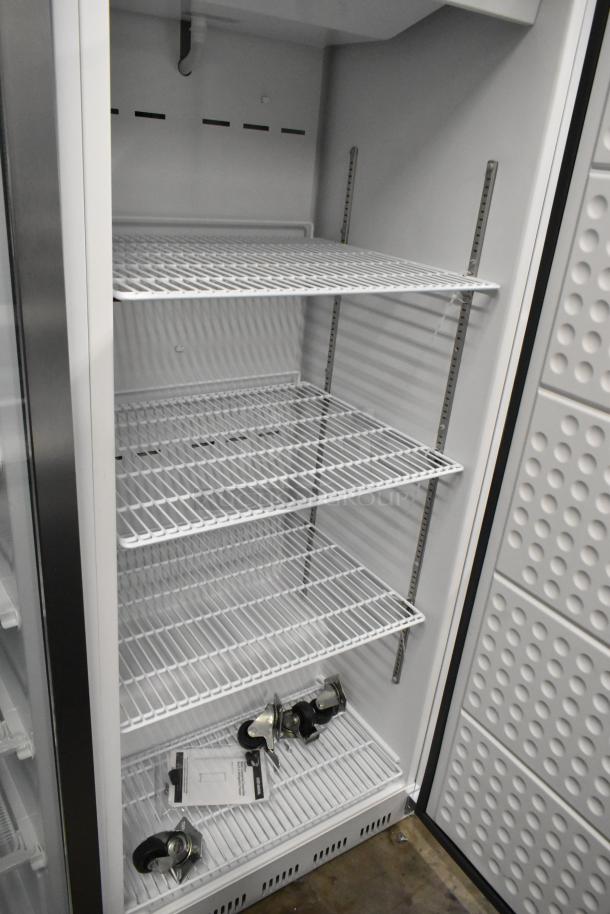 BRAND NEW KoolMore KM-RIC-1DWH one-door refrigerator/freezer, 25 cu. ft., with shelves, casters, and tags. 115V, 1 phase.