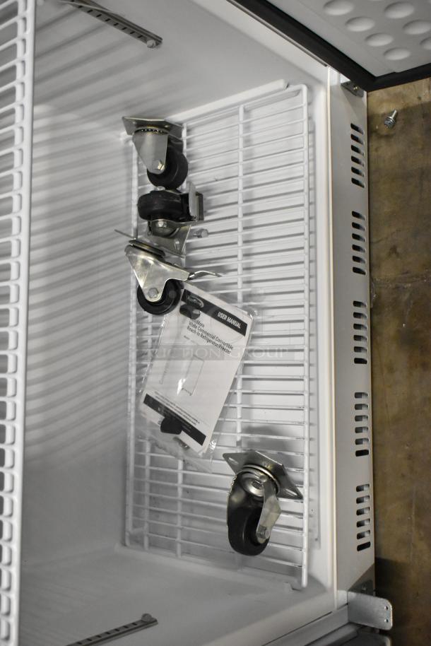 KoolMore KM-RIC-1DWH commercial fridge/freezer, new with user manual and caster wheels, 25 Cu. Ft., 115V, 1 phase.