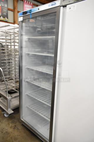 Brand new KoolMore KM-FMD20WGD 21 Cu. Ft. commercial freezer with glass door, 115 volts, 1 phase, visible shelving.