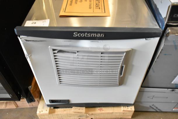 "Brand new 2024 Scotsman FS0522A-1B flake ice machine, 450 lb capacity, air-cooled, scratch and dent condition, Scotsman logo visible."