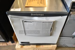 "Brand new 2024 Scotsman FS0522A-1B flake ice machine, 450 lb capacity, air-cooled, scratch and dent condition, Scotsman logo visible."