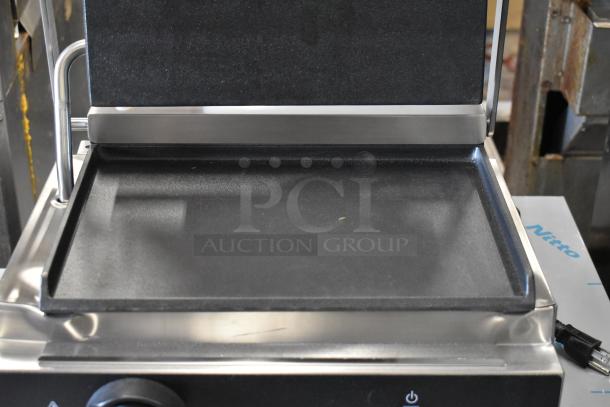 Brand new Vollrath TSI7011 panini grill with smooth cast iron plates, 13.5" x 9.25" surface, 120V, single phase.