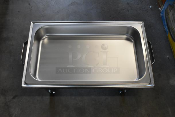 Brand new stainless steel chafing dish, scratch and dent condition, rectangular, with handles.