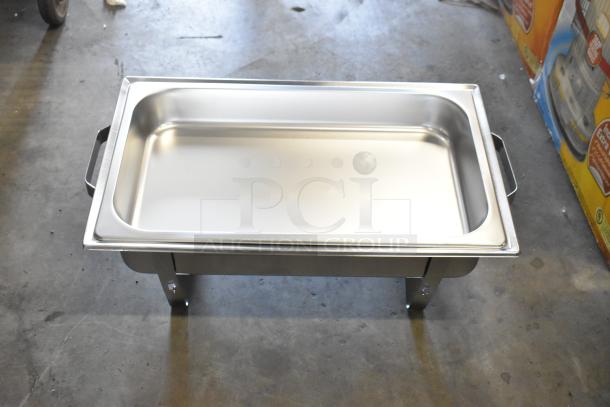 Brand new stainless steel chafing dish with handles, visible scratch and dent, ideal for catering and buffet use.