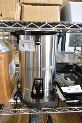 Brand new Avantco 177CU45ETL 45-cup stainless steel coffee urn, scratch and dent condition, with visible caution label and auction tag.