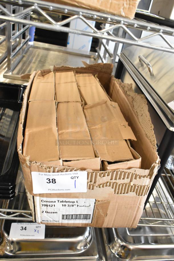 Box of Corona 700121 white oval platters, 10 3/8", brand new with scratch and dent, 2 dozen, visible labels and barcodes.