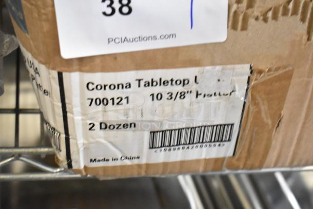 Box of Corona 700121 White Oval Platters, 10 3/8", 2 dozen, brand new with packaging dents, made in China.