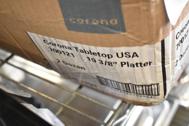 Box of Corona 700121 white oval platters, brand new with minor scratches, holds 2 dozen, 10 3/8" size.