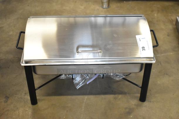 Stainless steel countertop chafer, brand new with minor scratches, includes lid and black handles, auction tag visible.
